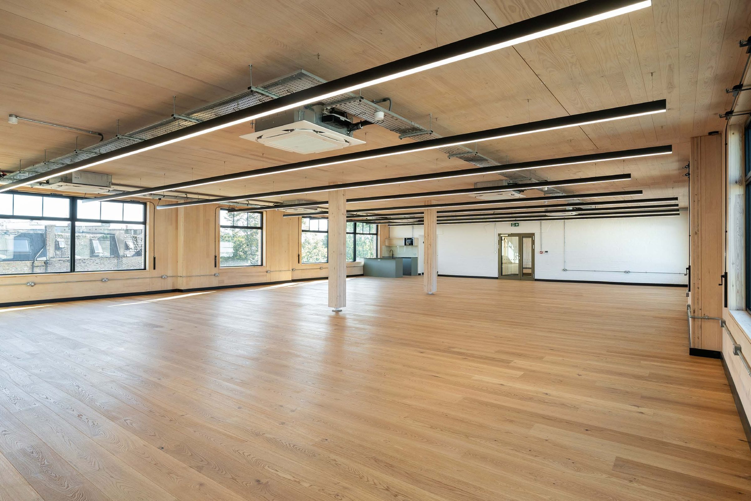 Third floor workspace with timber ceiling and oak floor