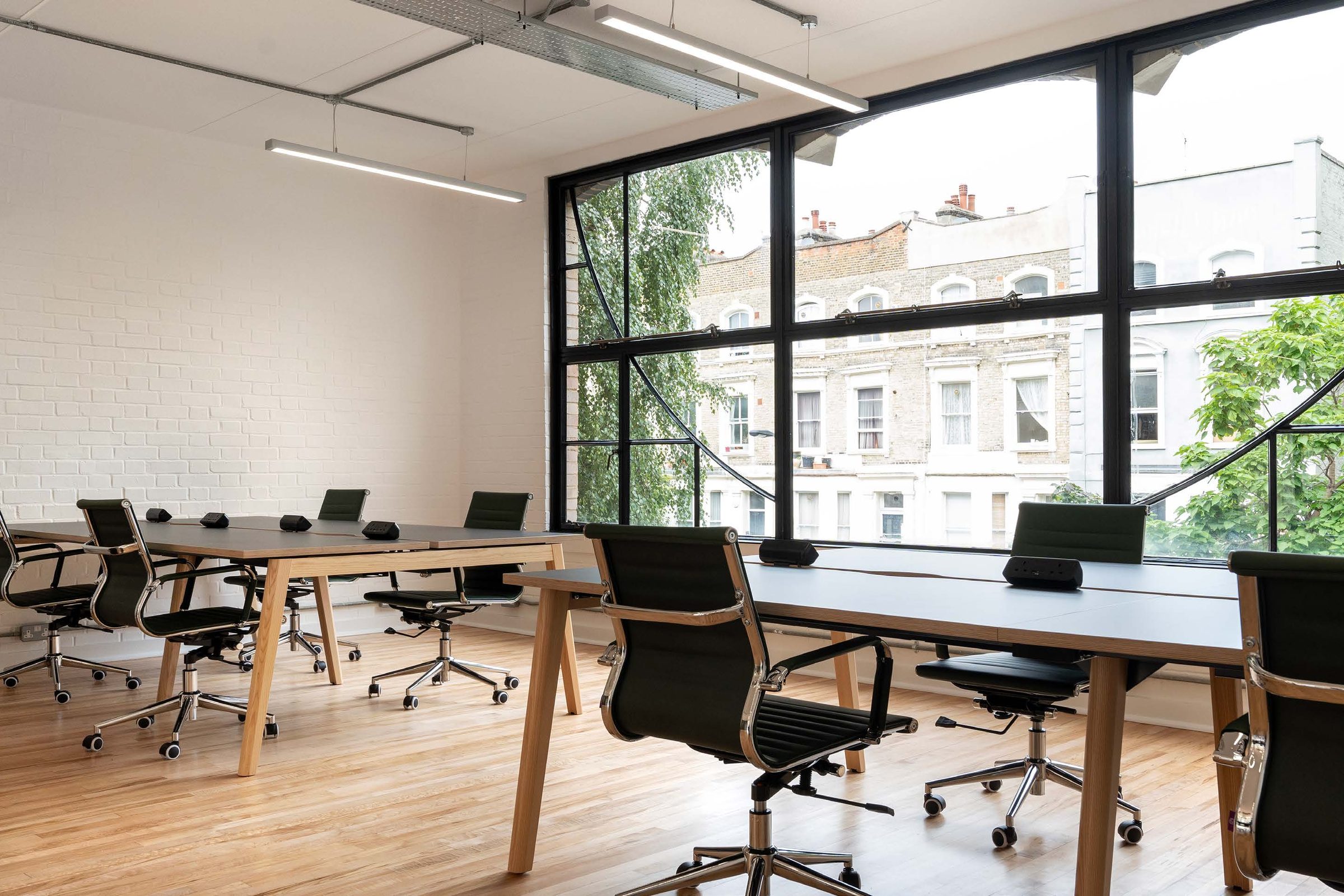 Workspace with full-height steel windows onto the street